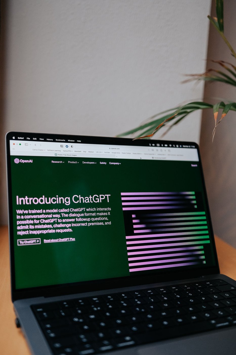 A laptop displaying an OpenAI ChatGPT page